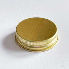 Load image into Gallery viewer, Set Of 7 Mini Amber Glass Jars With Gold Lids And White Labels
