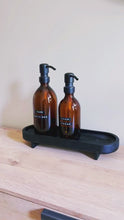 Load and play video in Gallery viewer, Amber Dispenser Bottle With Stamped Personalised Label And Black Metal Pump
